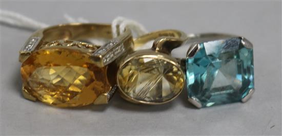 A blue zircon ring and a two other rings